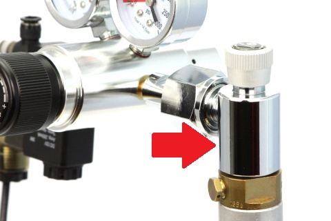 Photo of a SodaStream adapter in use.